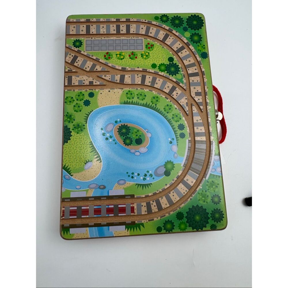 The photos show a Melissa & Doug Take-Along Railroad wooden travel train set.